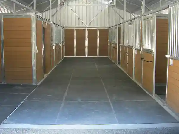 barn breezeway lined with rubber mats by s c barns