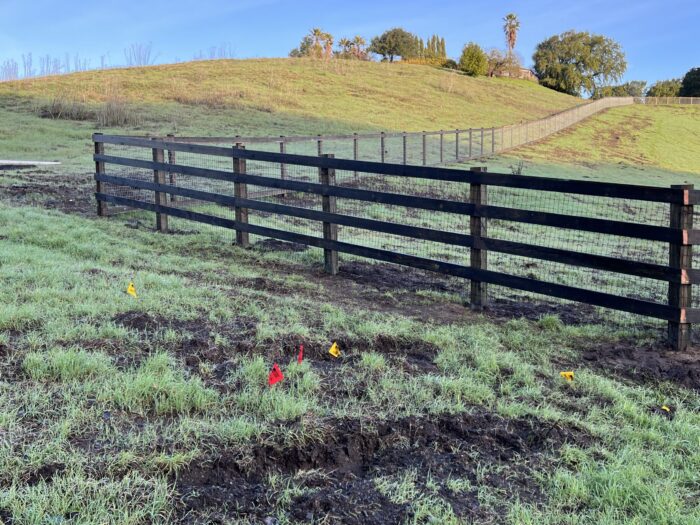 4 rail wood fence with 6x6 posts and black non-climb wire built by s c barns