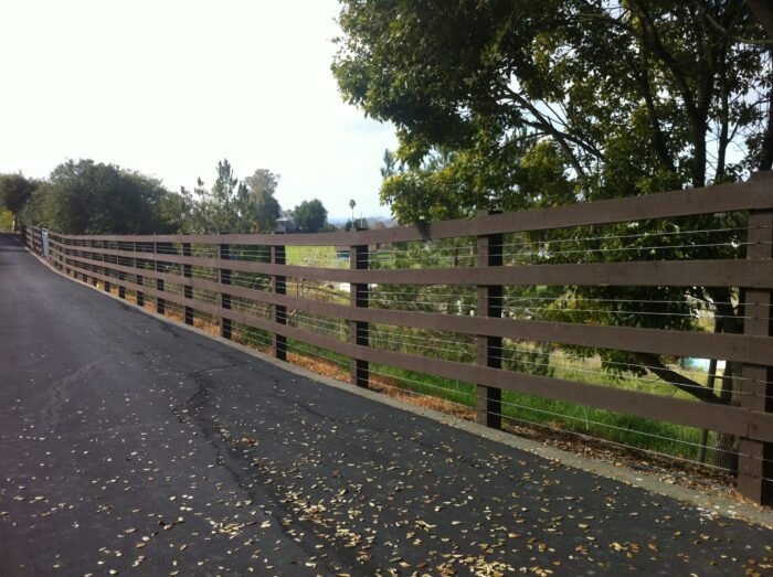 4 rail painted fence with smooth wire