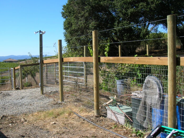 Non Climb Fence with top board and smooth wire