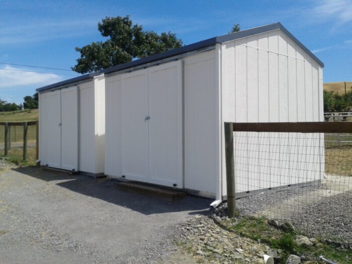 Plywood Sided Shed with Slide Doors Painted